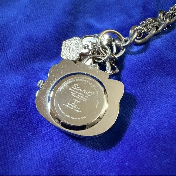 Hello Kitty Silver Charm Bracelet Watch with Pink Bow Accents - Picture 2 of 4